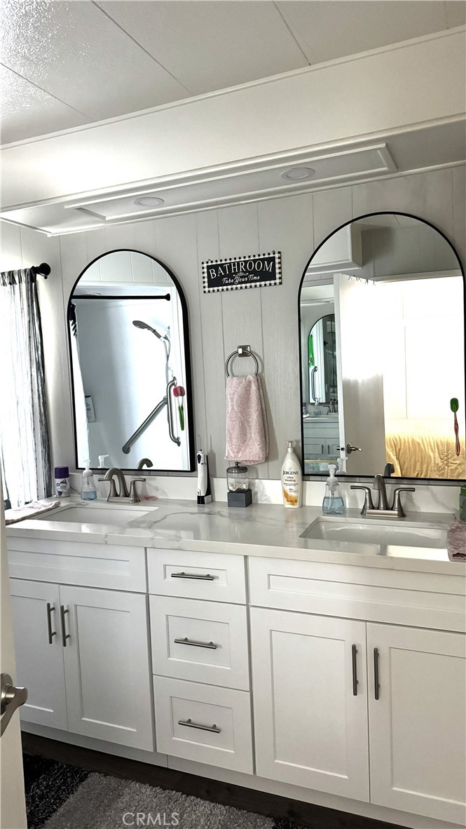 1001 West Lambert Road, Unit 153 La Habra, CA 90631 - Photo 9 of 28 a bathroom with sinks and two mirror