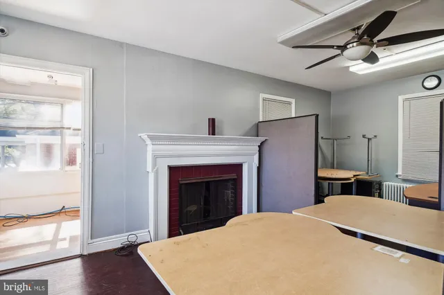 a bedroom with a bed and a fireplace