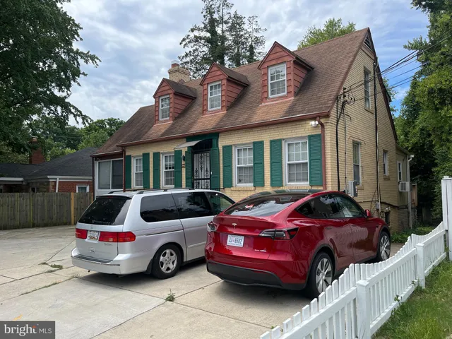 a front view of a house with parking space