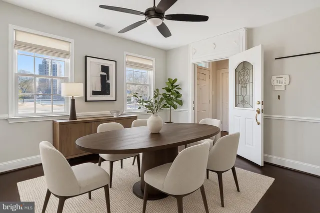 a dining room with furniture and window