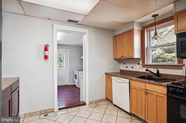 a utility room with cabinets a washer and dryer
