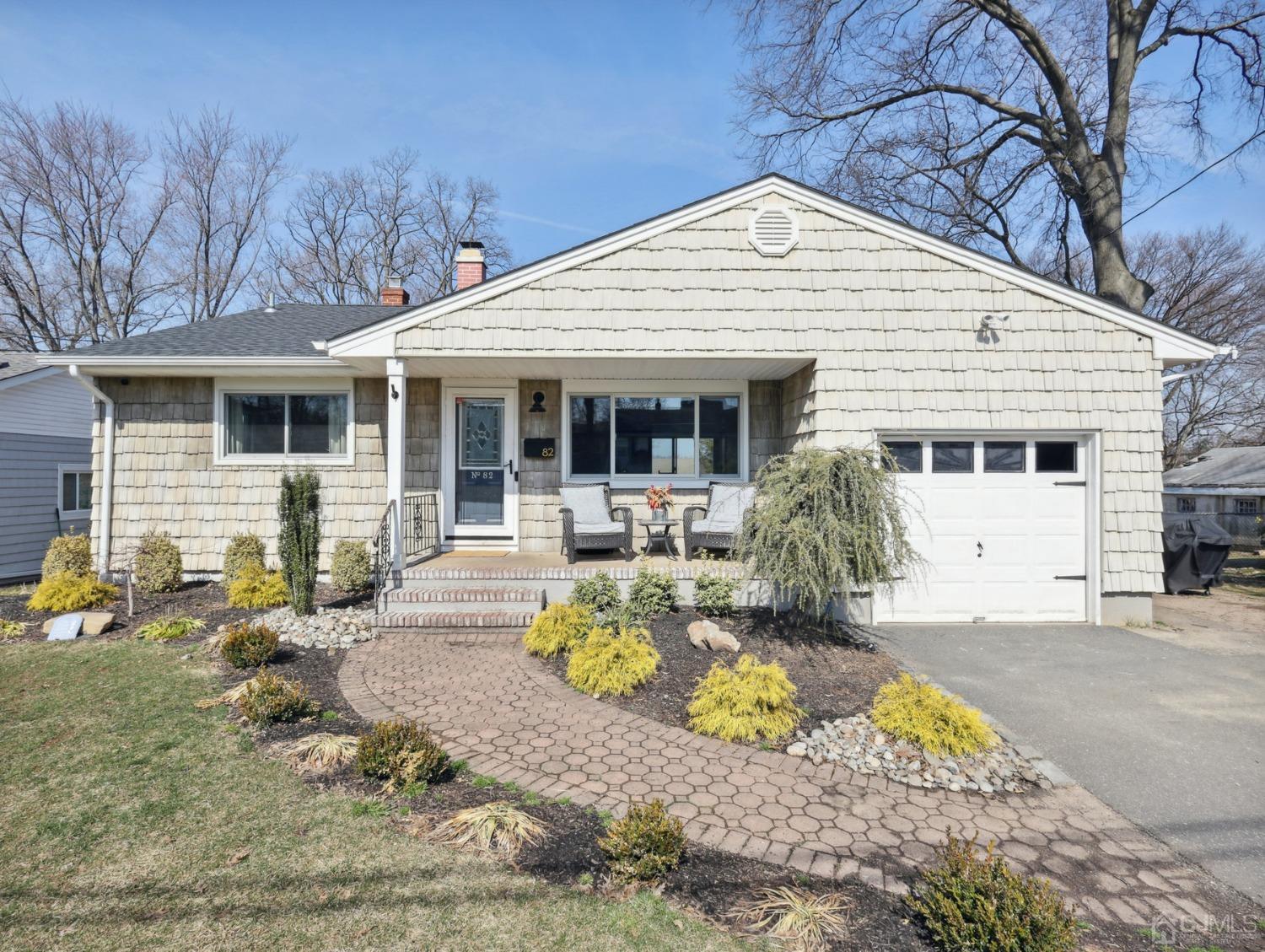 82 Normandy Road Colonia, NJ 07067 - Photo 1 of 33 a front view of a house with garden