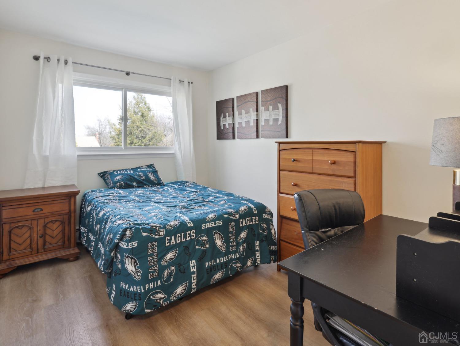 82 Normandy Road Colonia, NJ 07067 - Photo 13 of 33 a bedroom with a bed window and a desk