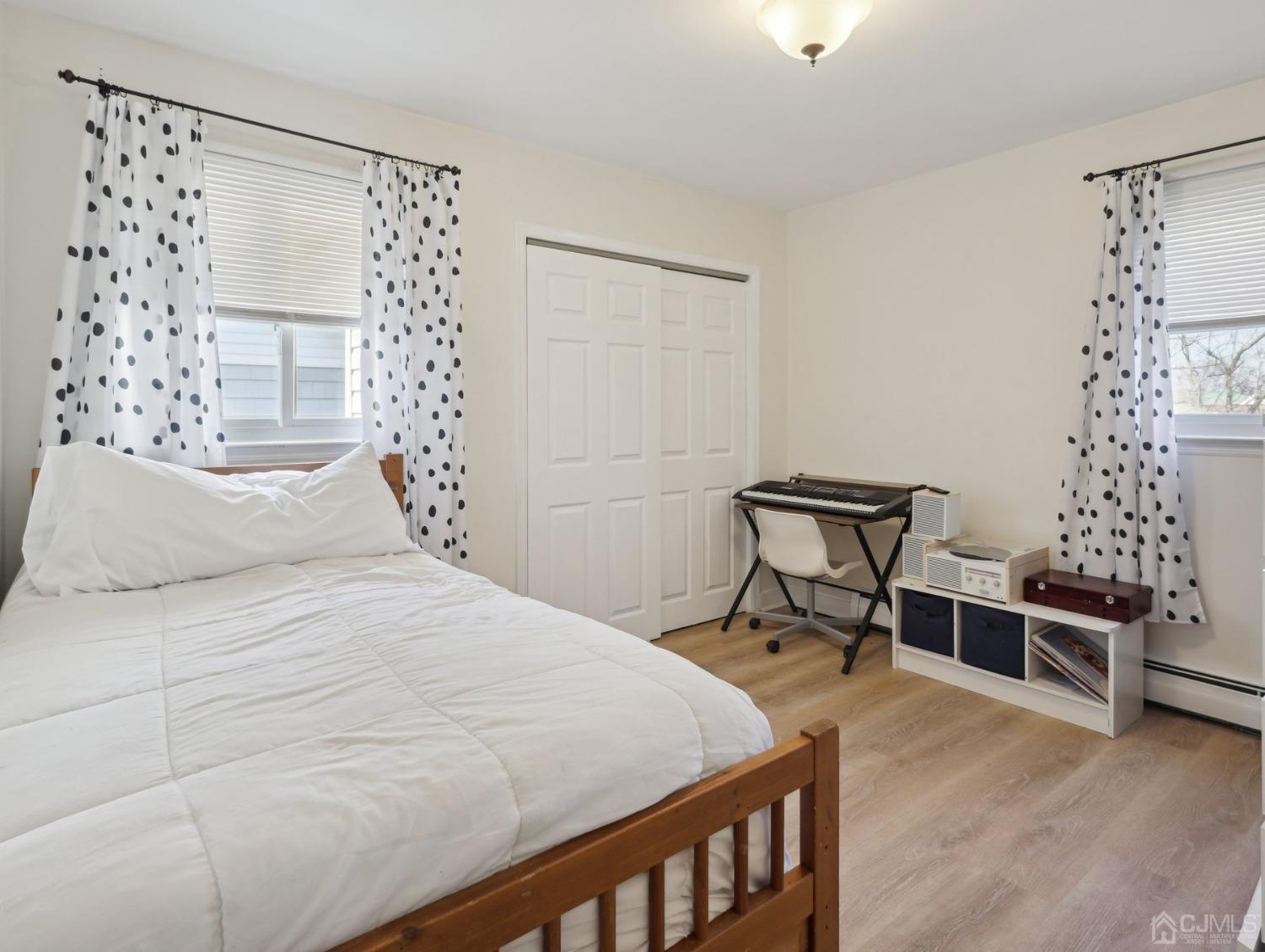 82 Normandy Road Colonia, NJ 07067 - Photo 14 of 33 a bedroom with a bed and a window