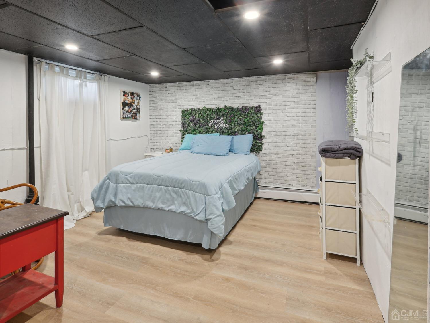 82 Normandy Road Colonia, NJ 07067 - Photo 20 of 33 a spacious bedroom with a bed and a window