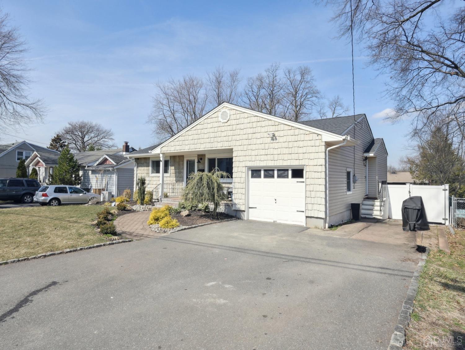 82 Normandy Road Colonia, NJ 07067 - Photo 2 of 33 a view of a parked cars in front of a house