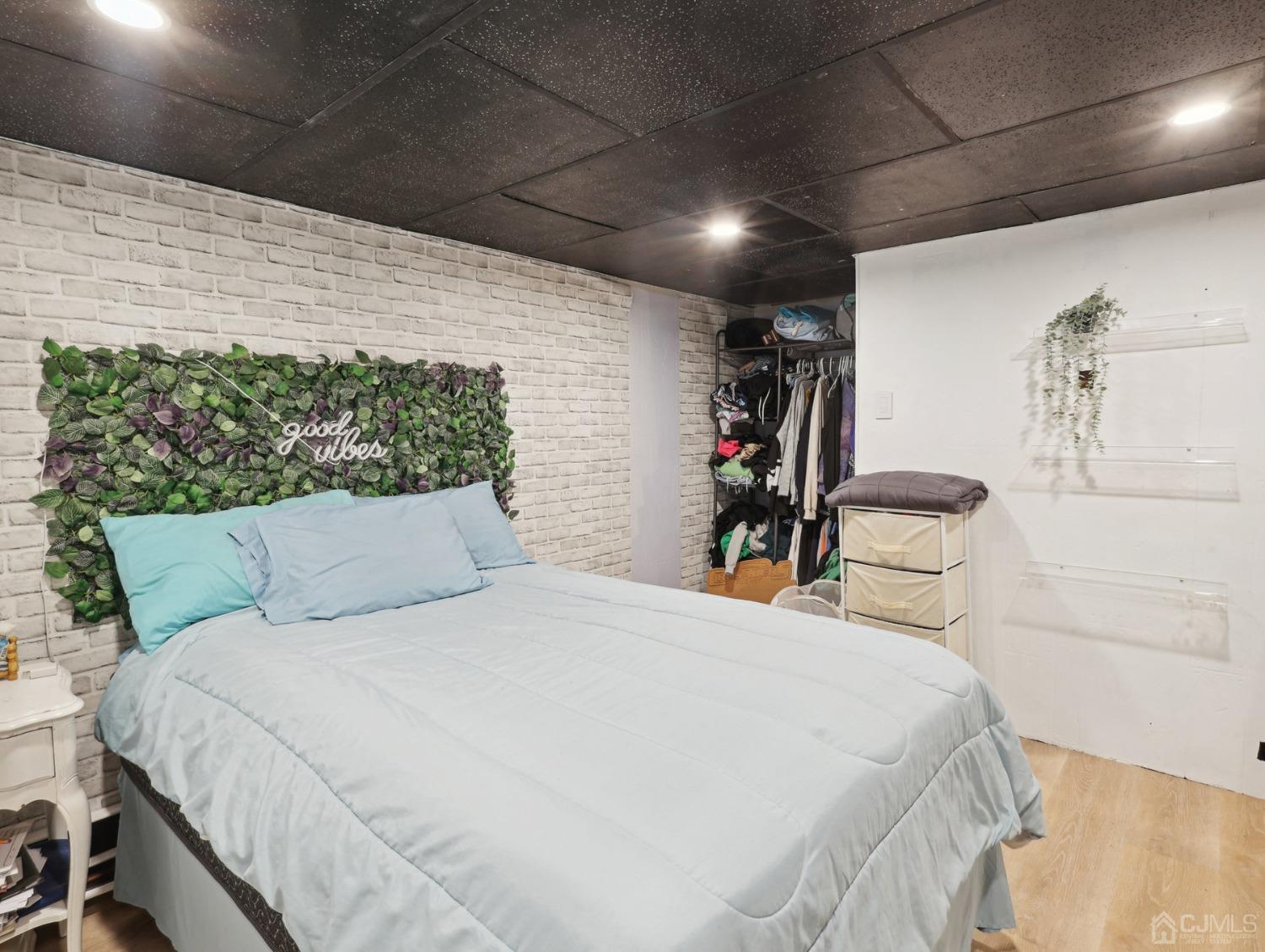 82 Normandy Road Colonia, NJ 07067 - Photo 21 of 33 a bed room with a bed and a walk in closet