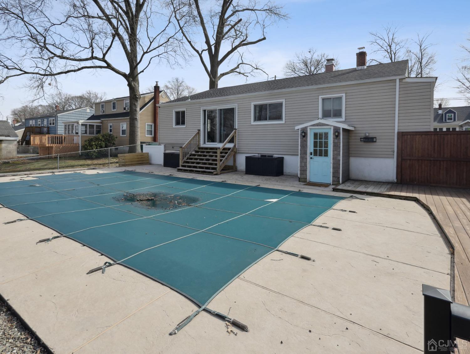 82 Normandy Road Colonia, NJ 07067 - Photo 27 of 33 a view of a backyard with a white house