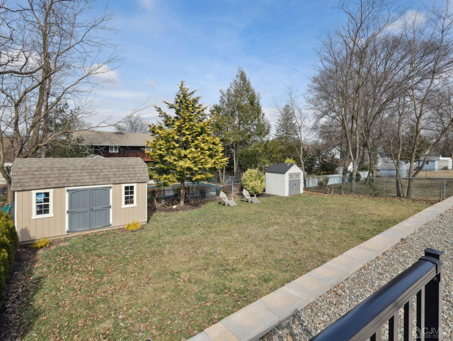 82 Normandy Road Colonia, NJ 07067 - Photo 28 of 33 a view of a house with a yard and tree s