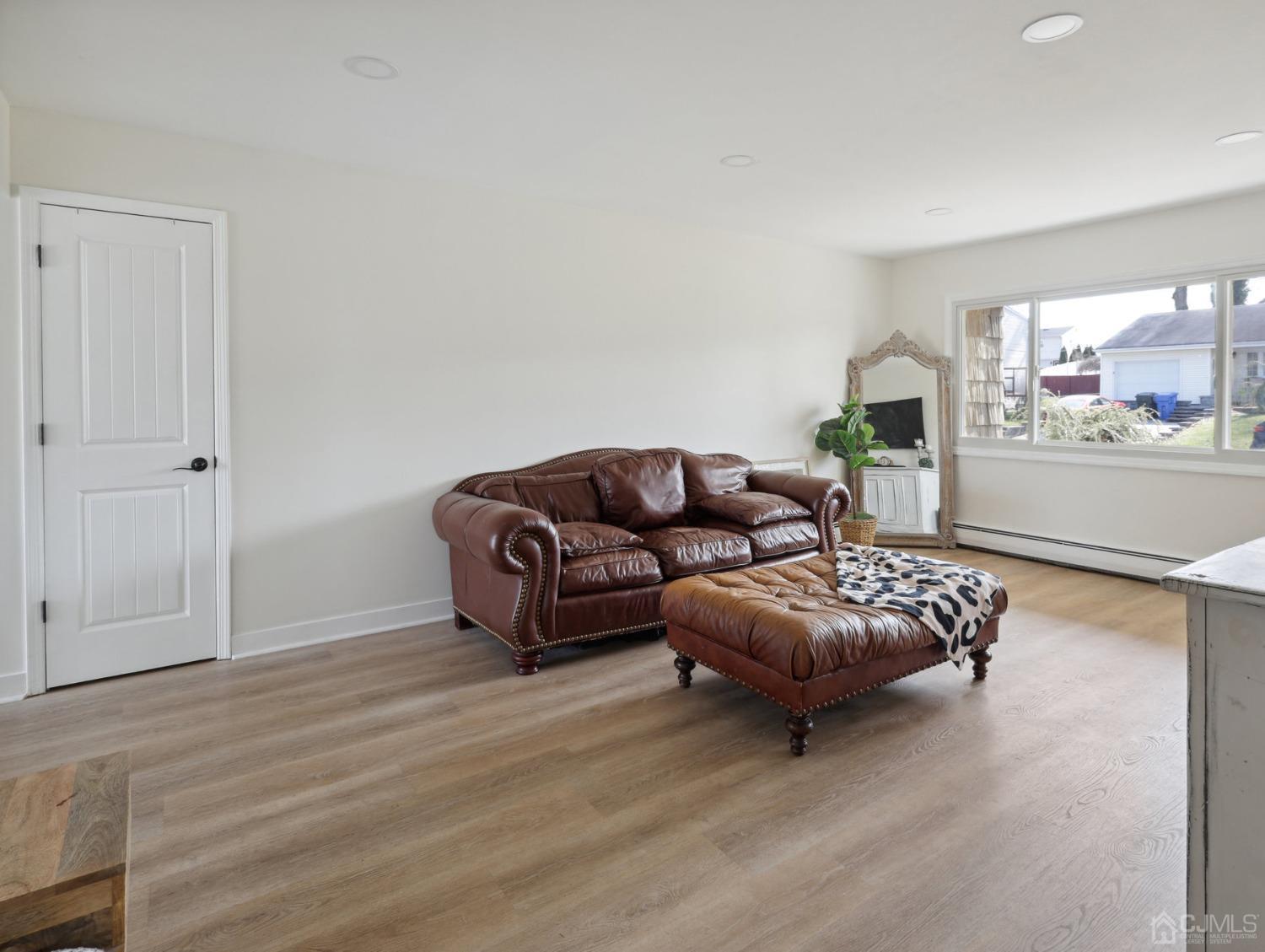 82 Normandy Road Colonia, NJ 07067 - Photo 4 of 33 a living room with furniture and a window