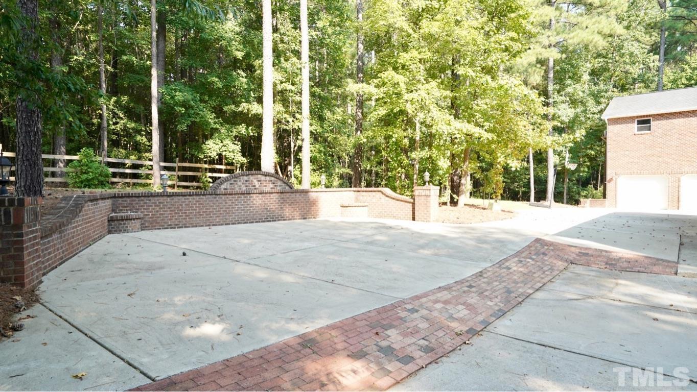 12362 Oneal Road Wake Forest, NC 27587 - Photo 23 of 24 With glimpse of detached structure (garage, stairs, full bath, bedroom, & sitting area)