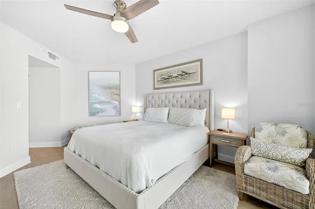 a bedroom with a bed and a couch