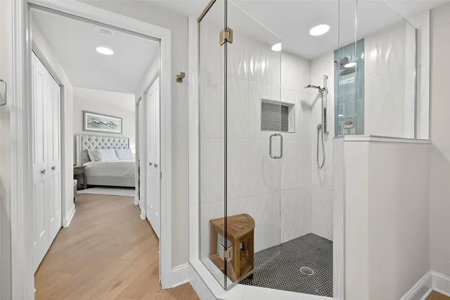 a bathroom with a shower and a tub