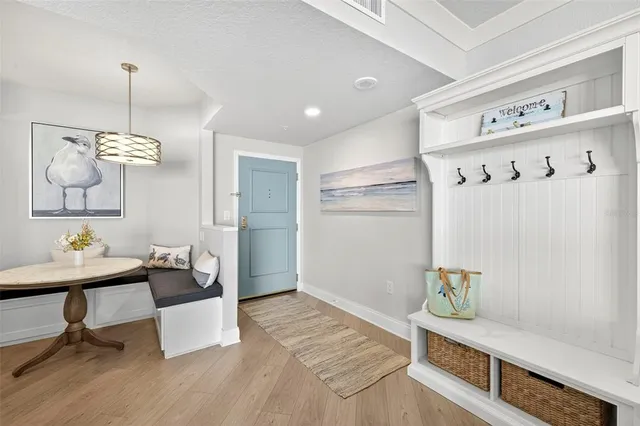a view of room with furniture and wooden floor