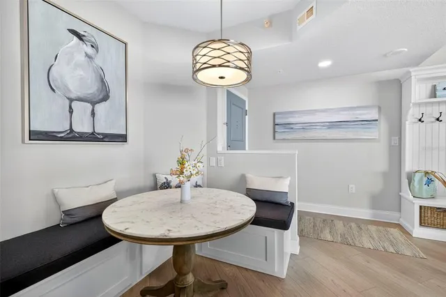 a view of a room with furniture and chandelier