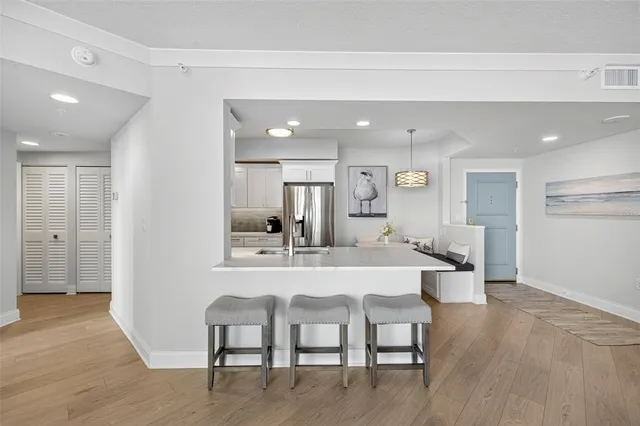 a view of a dining room with furniture and wooden floor