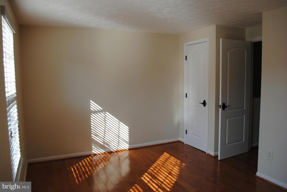 1943 Belmont Ridge Court Reston, VA 20191 - Photo 13 of 26 a view of an empty room and wooden floor