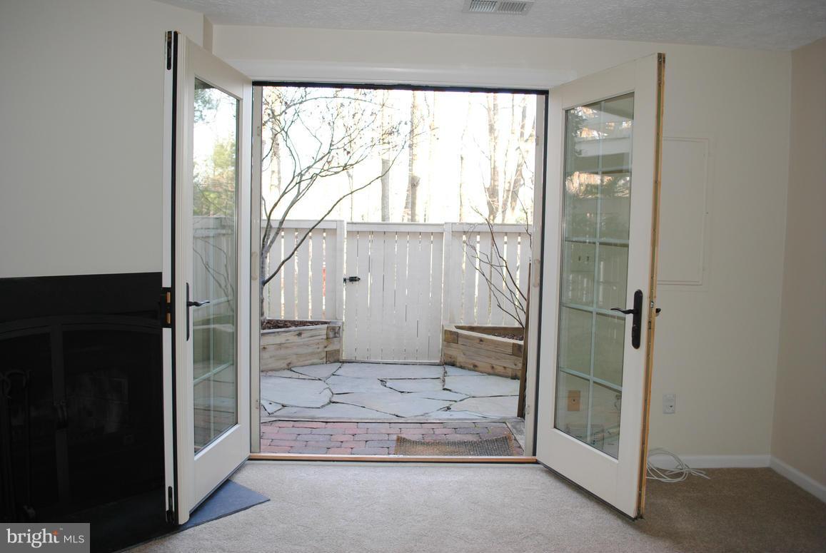 1943 Belmont Ridge Court Reston, VA 20191 - Photo 22 of 26 a bathroom with a glass shower door and mirror