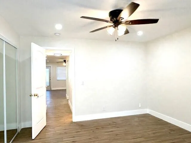 a view of an empty room and wooden floor