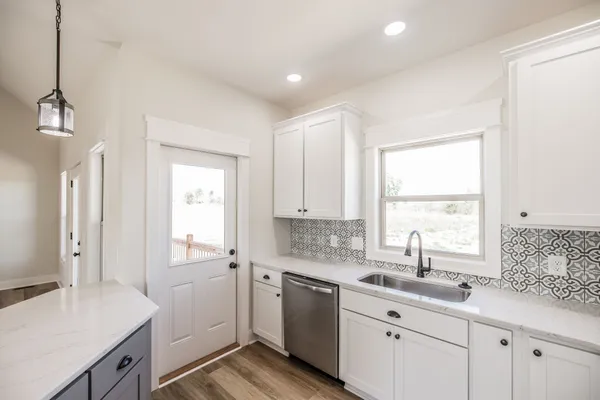 a bathroom with a sink and shower