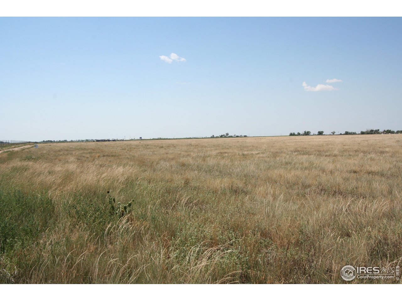 0 County Road 4 Wiggins, CO 80654 - Photo 4 of 17 a view of an ocean beach and mountain