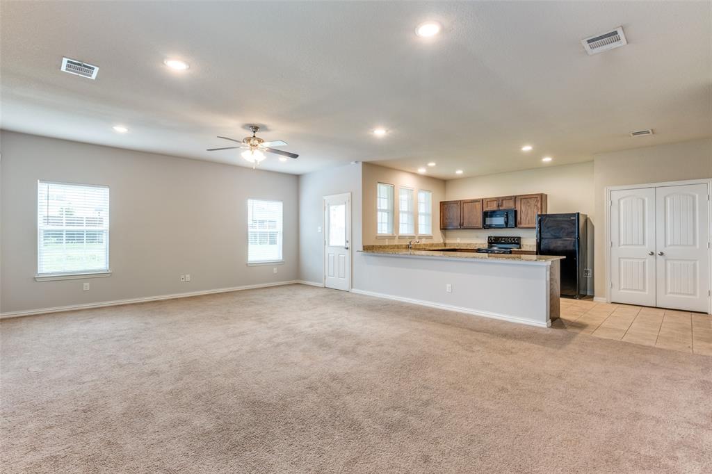 4662 Ralph Lane Dallas, TX 75227 - Photo 5 of 25 Living room with view of kitchen