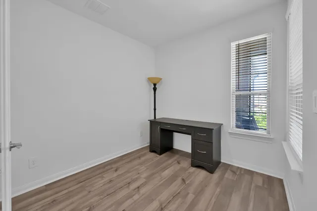 a room with a table and a window