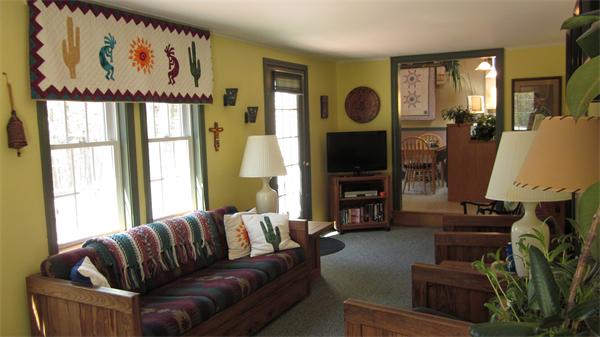 11 Rice Corner Road Brookfield, MA 01506 - Photo 10 of 30 a living room with furniture a flat screen tv and a fireplace