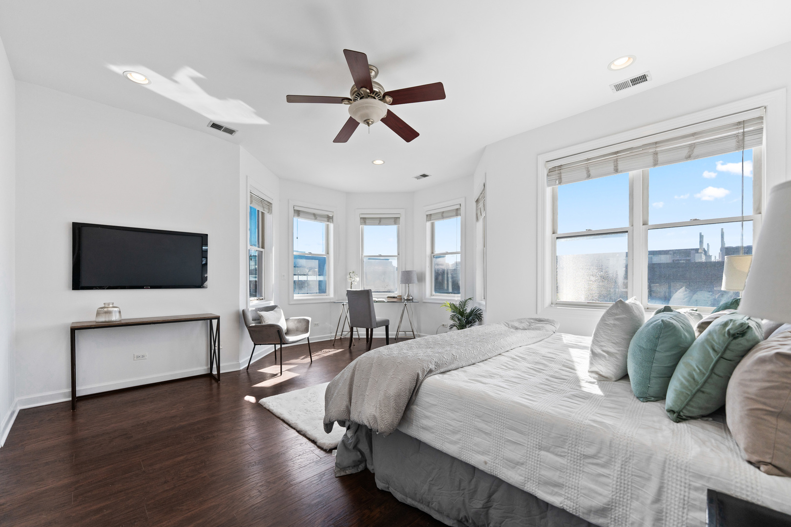 4603 North Racine Avenue, Unit 403 Chicago, IL 60640 - Photo 11 of 21 a bedroom with a bed window and a flat screen tv