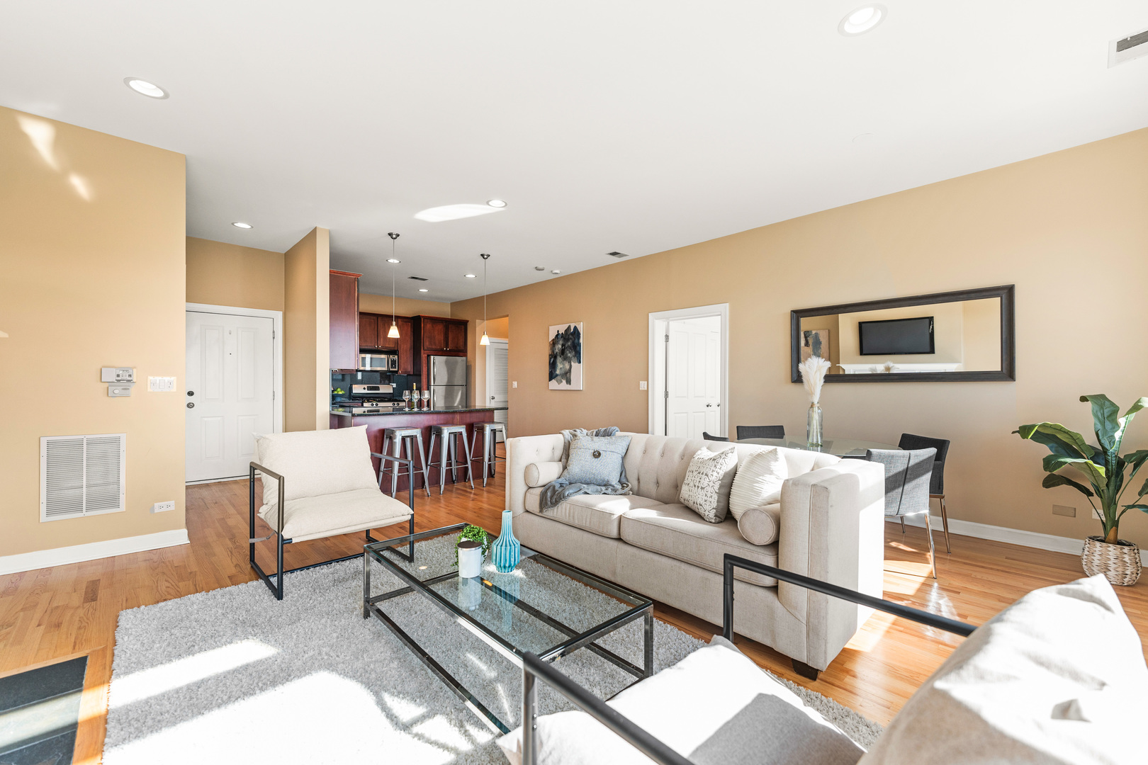 4603 North Racine Avenue, Unit 403 Chicago, IL 60640 - Photo 2 of 21 a living room with furniture and a table
