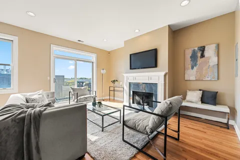 a living room with furniture fireplace and a flat screen tv