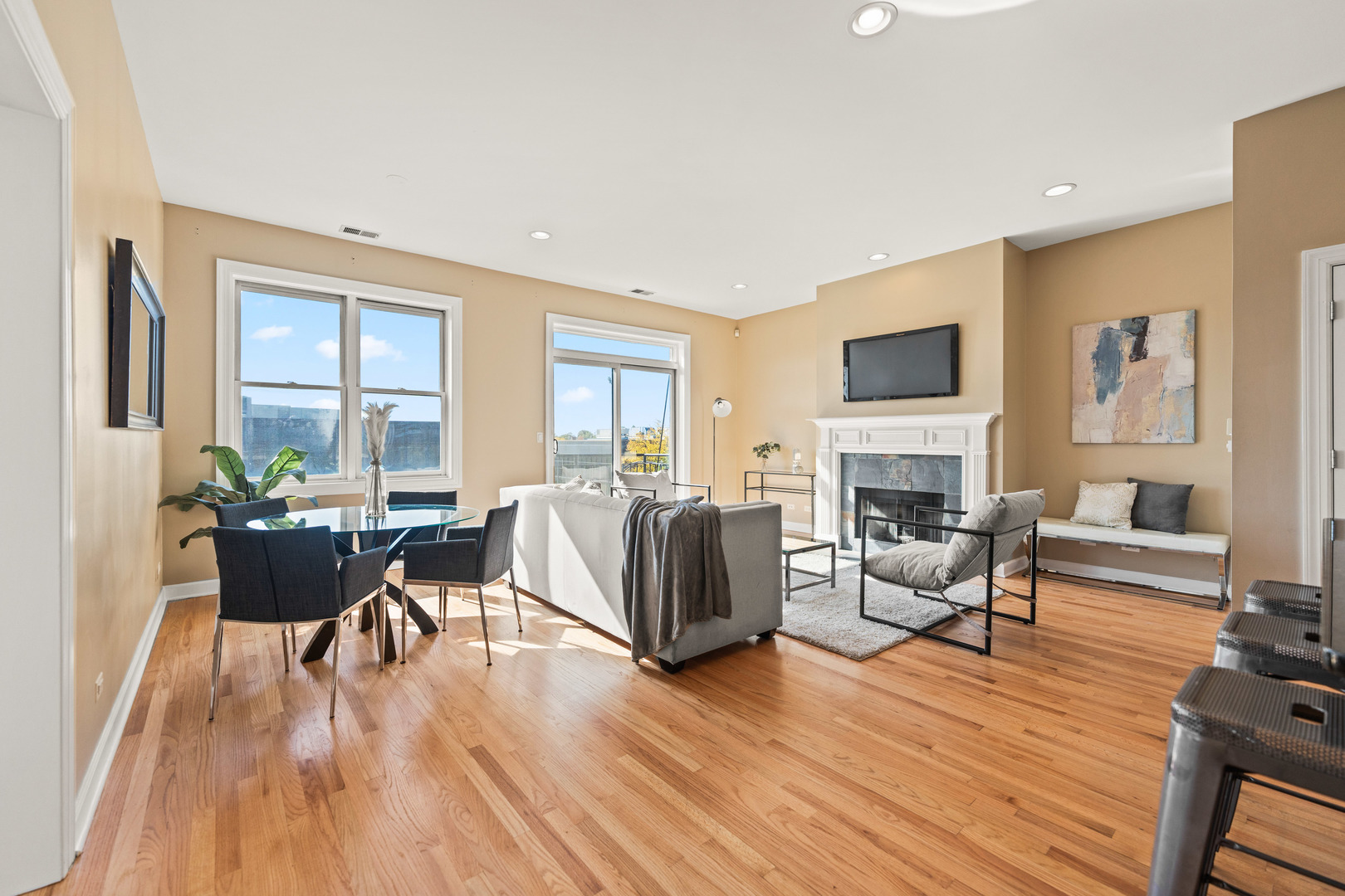 4603 North Racine Avenue, Unit 403 Chicago, IL 60640 - Photo 5 of 21 a living room with fireplace furniture and a wooden floor