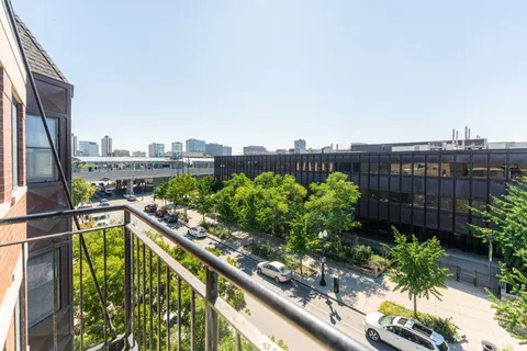 a view of a balcony with wooden floor
