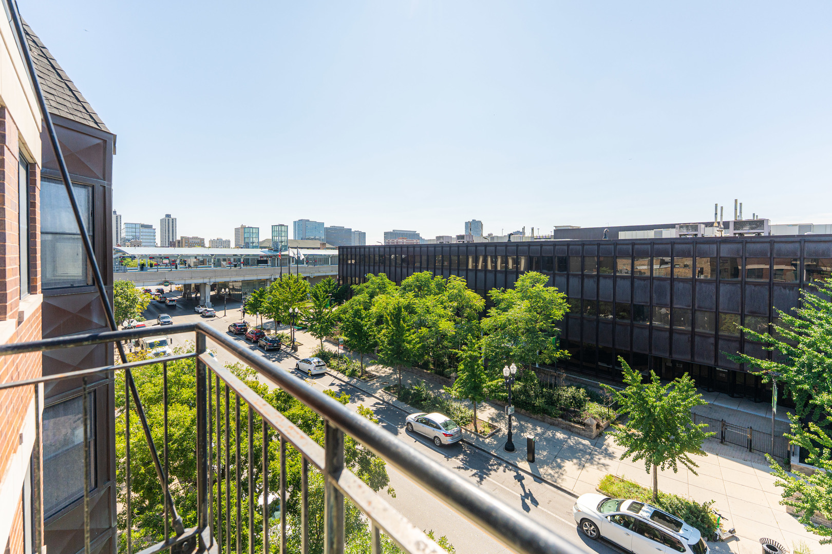 4603 North Racine Avenue, Unit 403 Chicago, IL 60640 - Photo 9 of 21 a view of a balcony with wooden floor