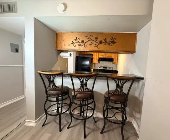 a view of a chairs and table in a kitchen