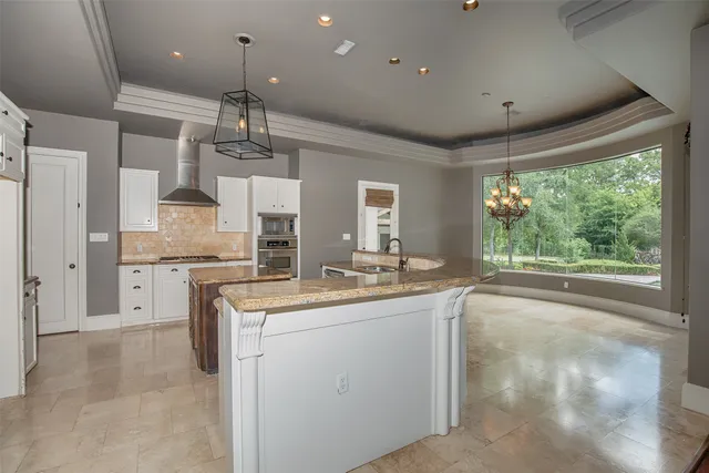 a white stove top oven sitting inside of a kitchen
