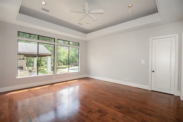 a large spacious bathroom with a granite countertop sink and a bathtub