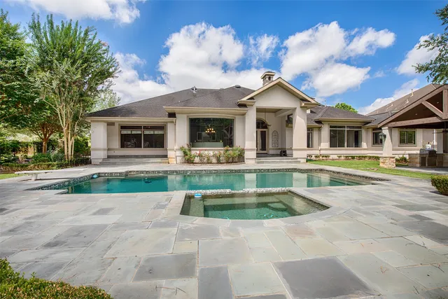 a view of a house with a yard patio and a patio