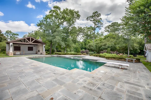 a view of garden with swimming pool