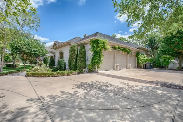 a front view of a house with a yard patio and fire pit