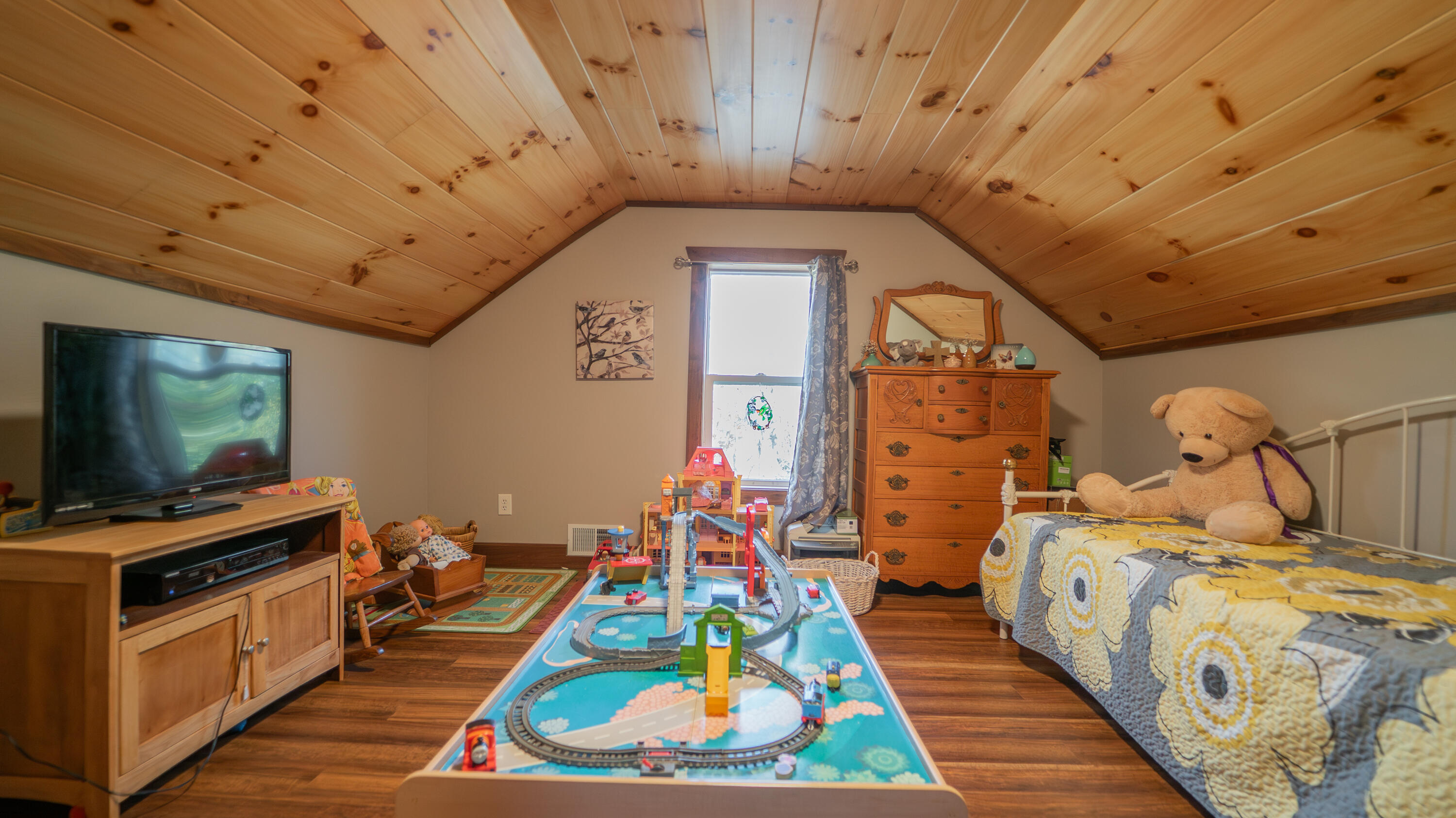 5099 Sage Road Plymouth, IN 46563 - Photo 11 of 35 a bed room with furniture and a flat screen tv