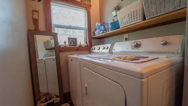 a utility room with dryer and washer