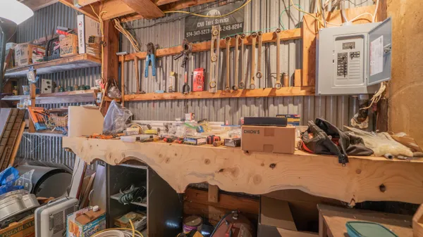 a view of a patio with table and chairs
