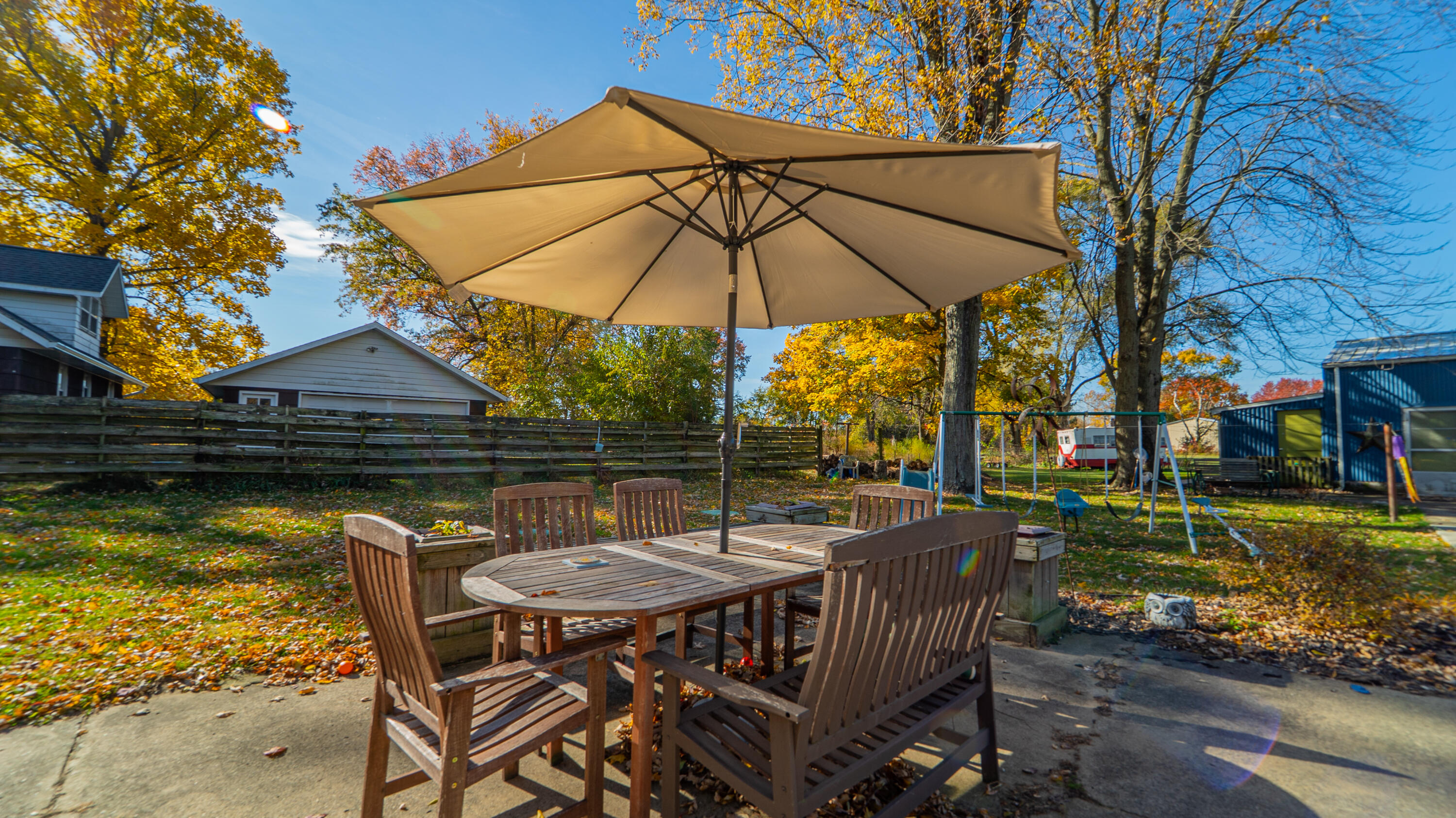 5099 Sage Road Plymouth, IN 46563 - Photo 24 of 35 a view of a patio with a table chairs and a swimming pool