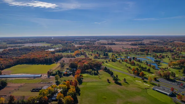an aerial view of residential houses with outdoor space