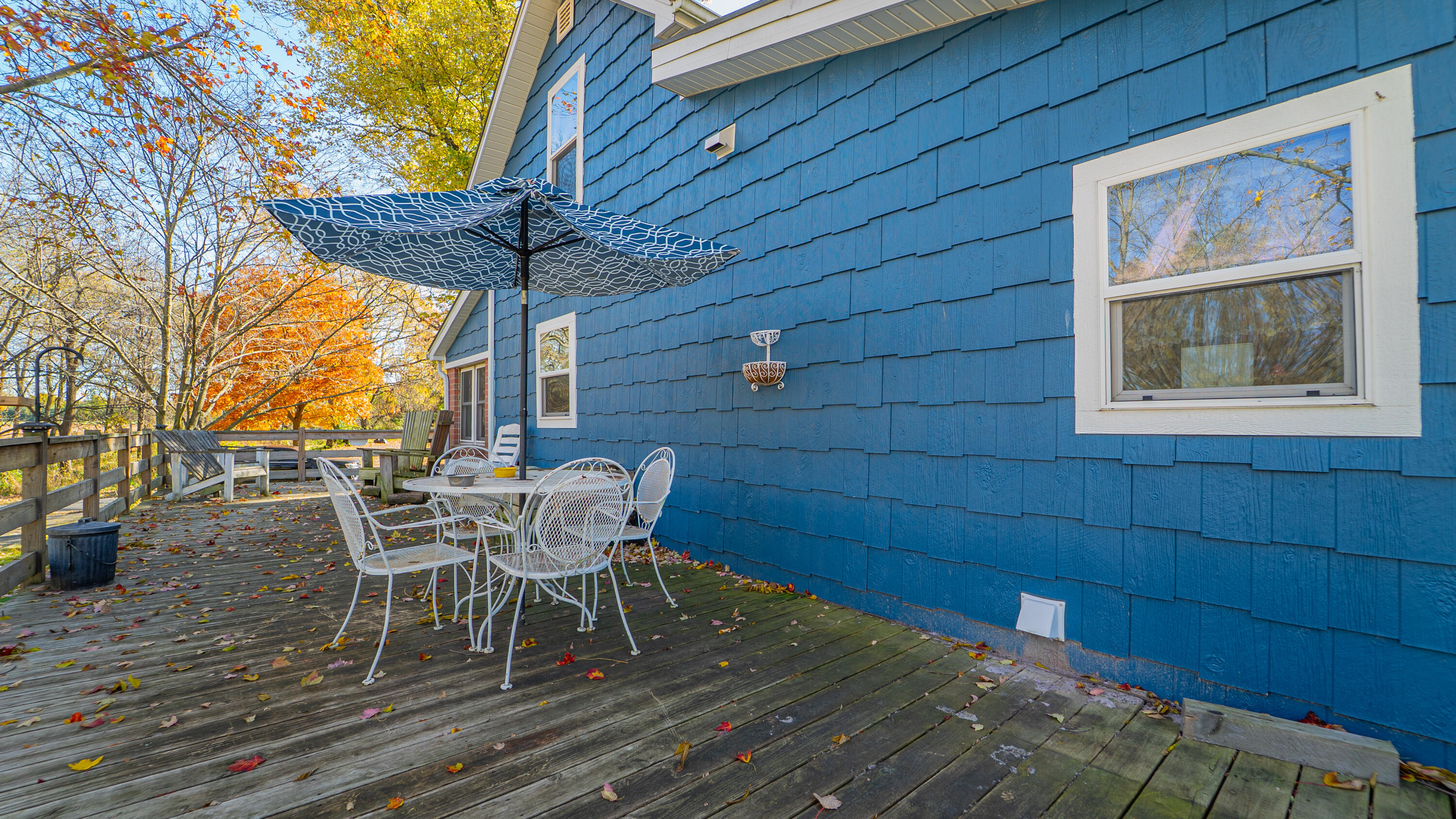 5099 Sage Road Plymouth, IN 46563 - Photo 3 of 35 a patio with table and chairs and potted plants