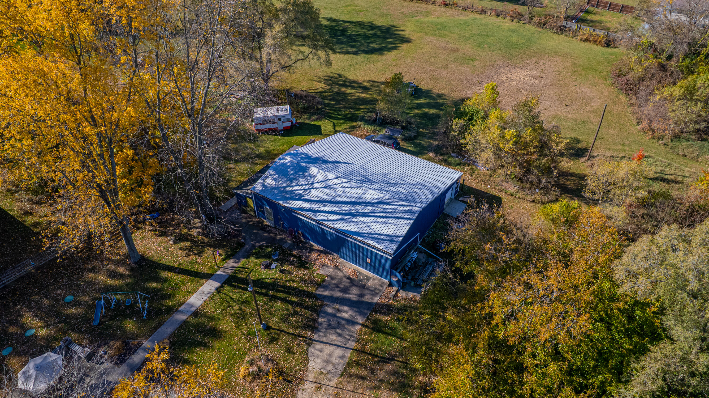 5099 Sage Road Plymouth, IN 46563 - Photo 31 of 35 a view of a backyard with plants