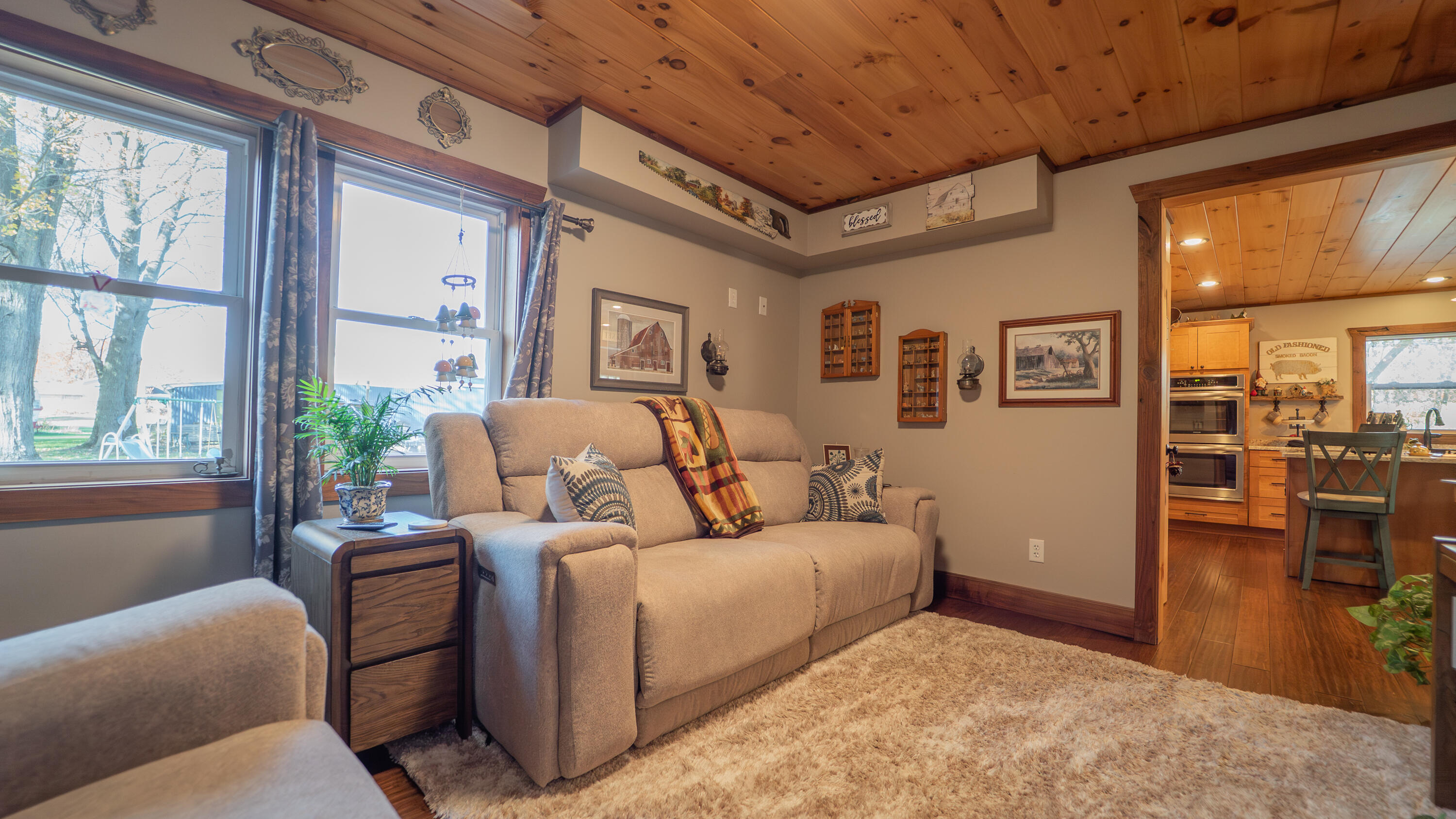 5099 Sage Road Plymouth, IN 46563 - Photo 8 of 35 a living room with furniture and a large window