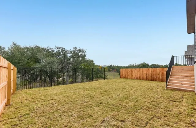 a view of swimming pool with a yard