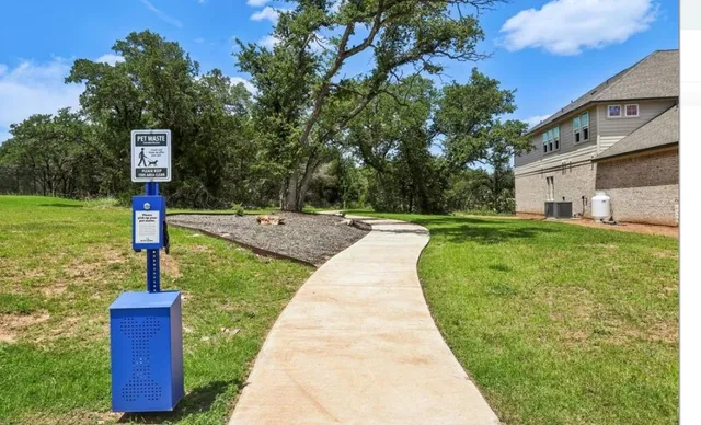 a view of a swimming pool with a yard
